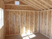 10x14 White Cottage style storage shed with shiplap siding interior